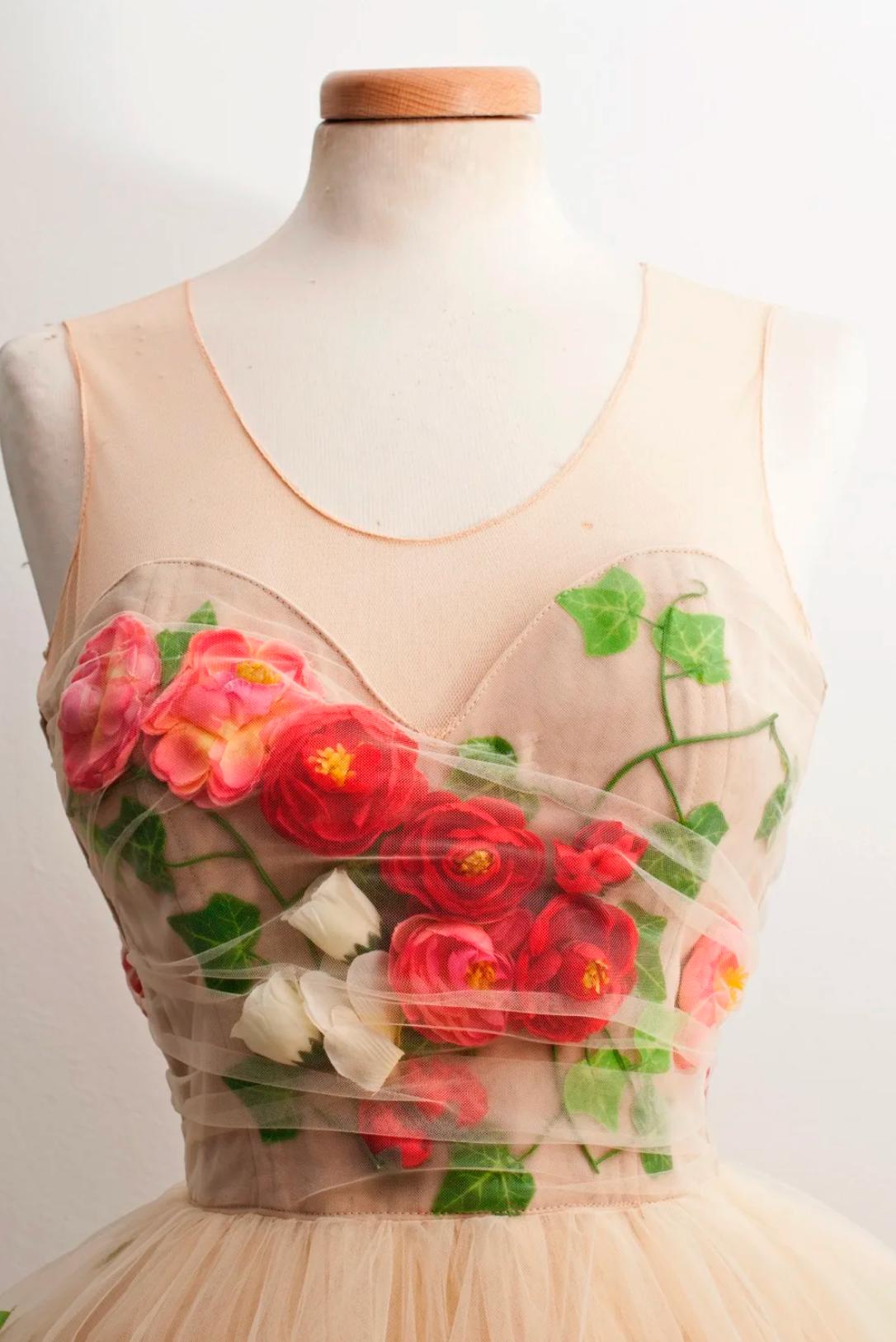 Nude tulle midi dress featuring a scoop neckline and vibrant 3D red rose appliqués with green leaf details.