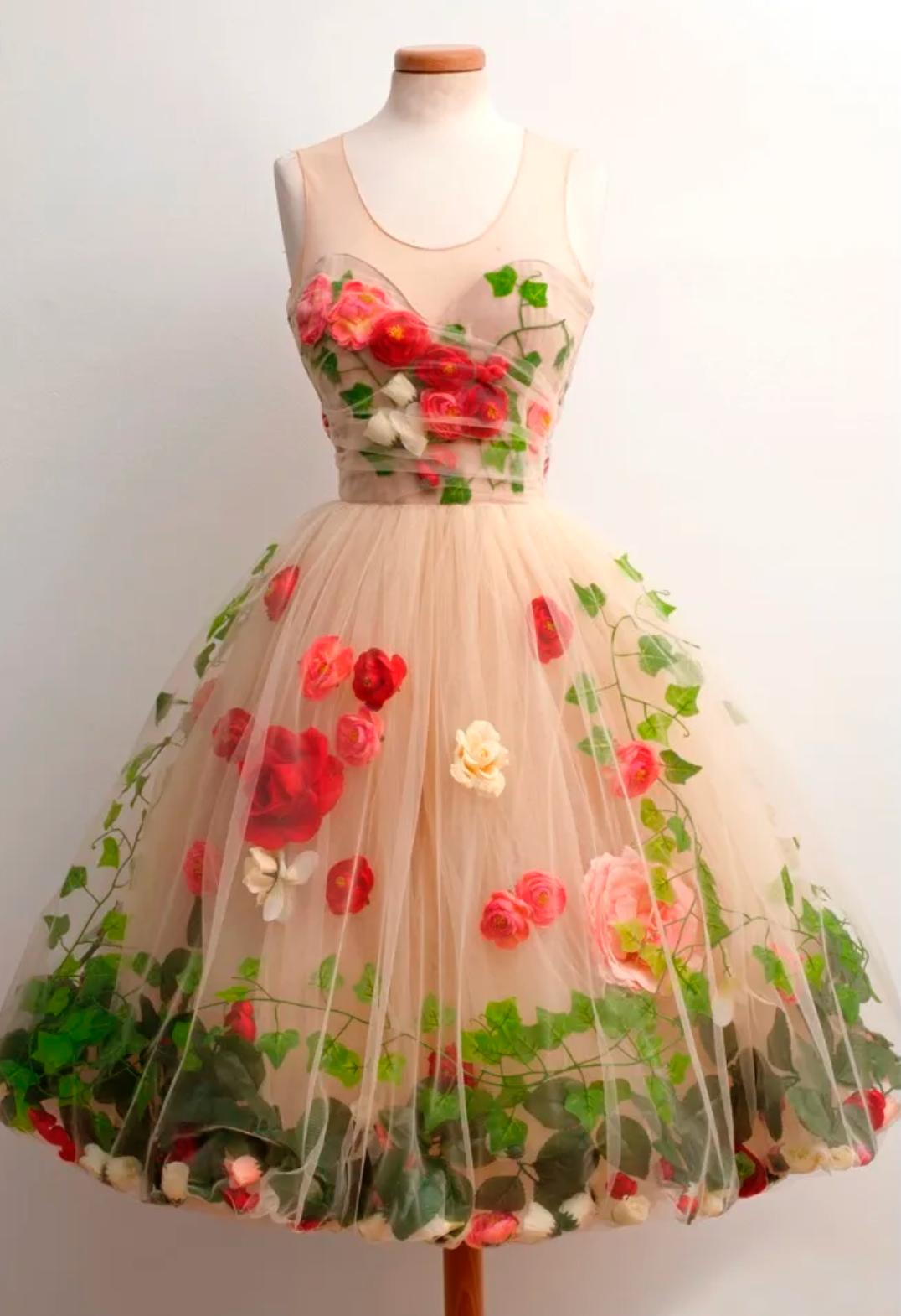 Nude tulle midi dress featuring 3D red roses and green ivy leaf appliqués with a scoop neckline and A-line silhouette.