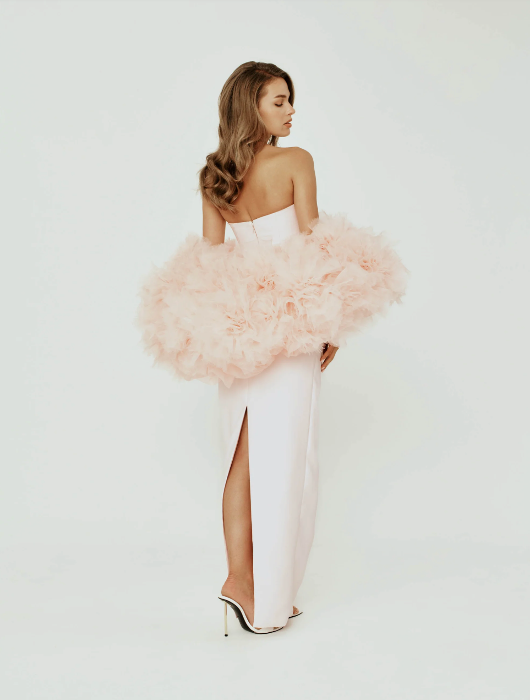 Strapless Mikado satin column gown in blush pink with a sculptural organza cape featuring hand-crafted floral details.