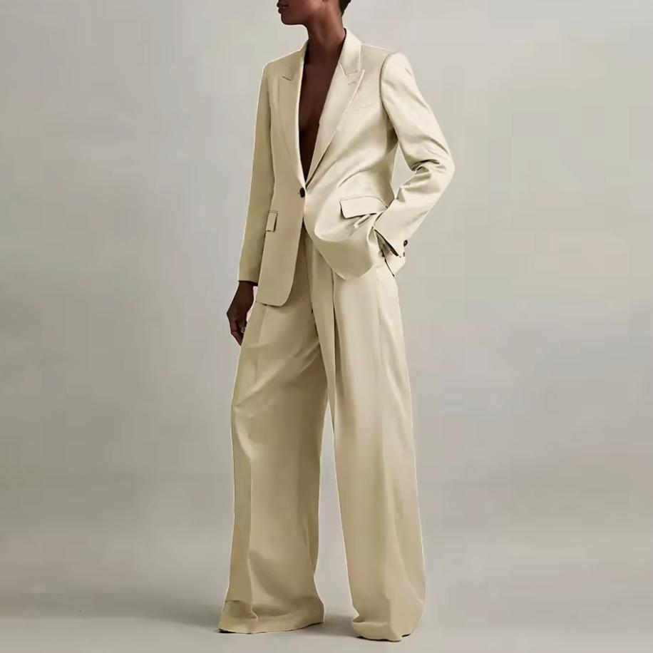 Champagne silk satin pant suit featuring an oversized single-button blazer and wide-leg trousers.