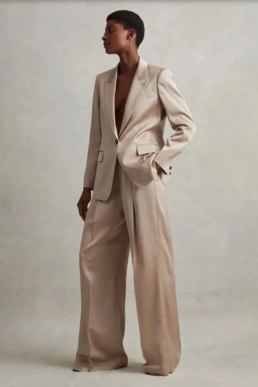 Champagne silk satin pant suit featuring a tailored single-button blazer and wide-leg trousers.
