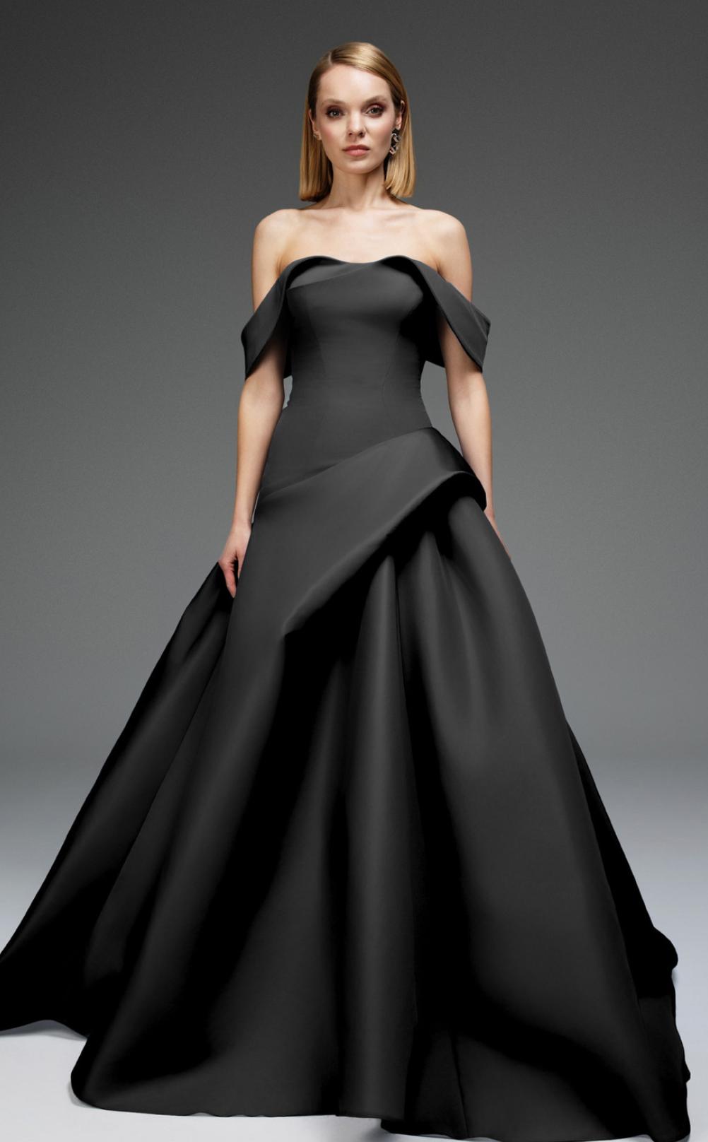 Black off-shoulder satin gown with a pleated bodice and structured mikado skirt on a model.