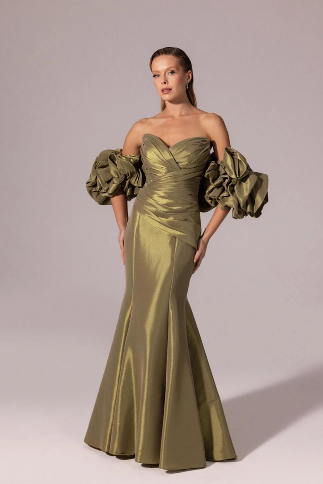 Olive green mermaid evening gown in shimmering taffeta with off-the-shoulder ruffled sleeves and a sweetheart neckline.
