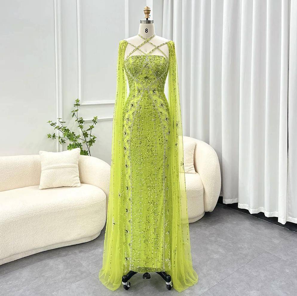 Lime green mermaid gown with cape sleeves, criss-cross neckline, and intricate crystal and sequin tulle embellishments.