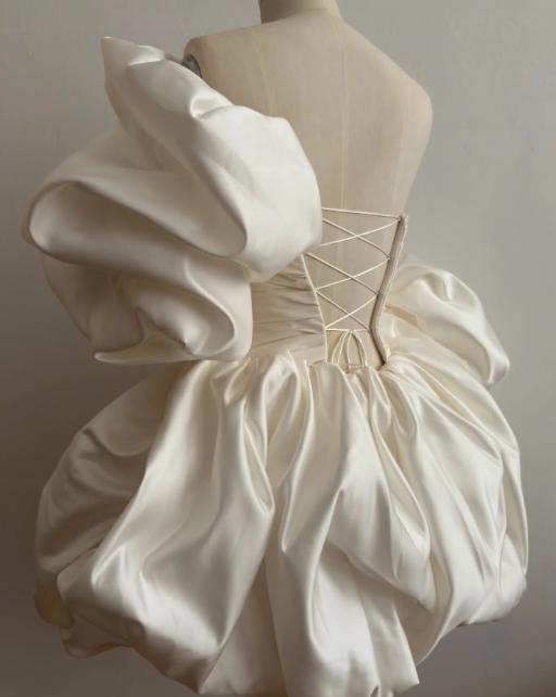 White satin mini prom dress with a ruffled sweetheart neckline, voluminous puff sleeves, and a lace-up corset back.