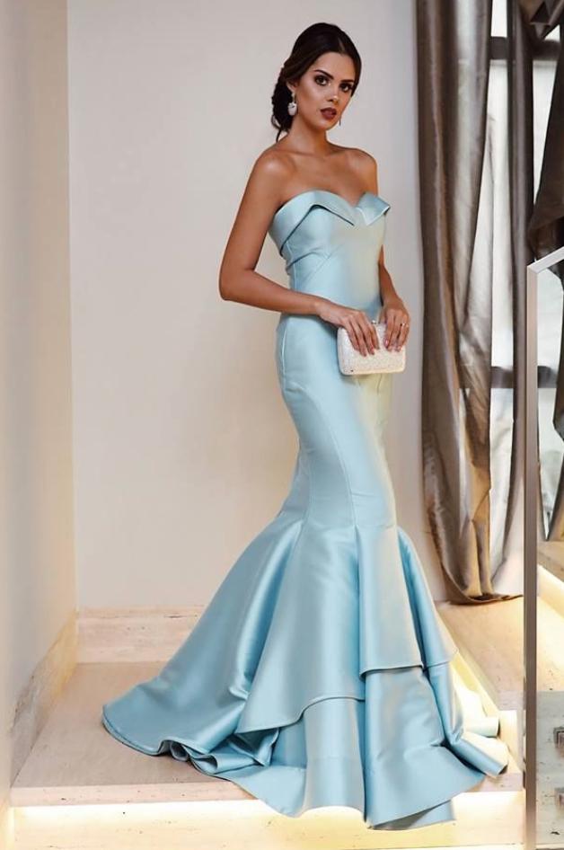 Light blue satin mermaid evening dress with a strapless sweetheart neckline and tiered skirt detail.