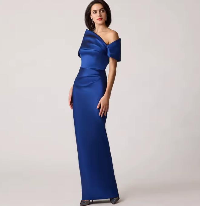 Royal blue stretch-mikado floor-length gown with an asymmetrical off-shoulder neckline and sculptural arm cuff.