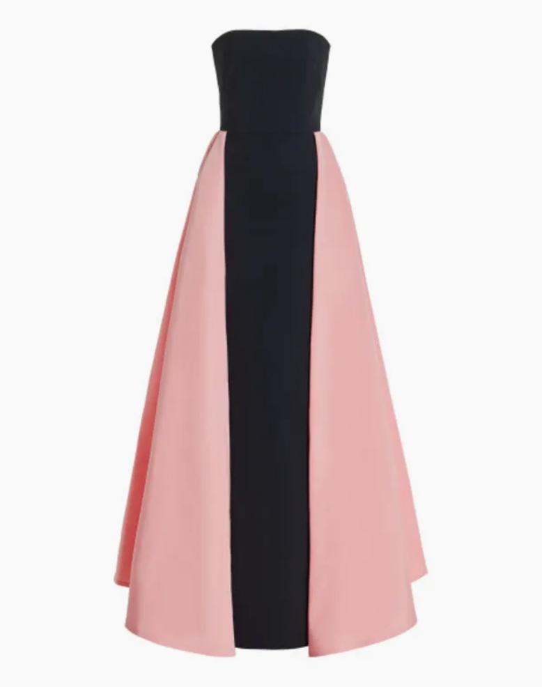 Black and pink silk faille evening gown featuring a strapless bodice and a dramatic, flowing cape overlay.