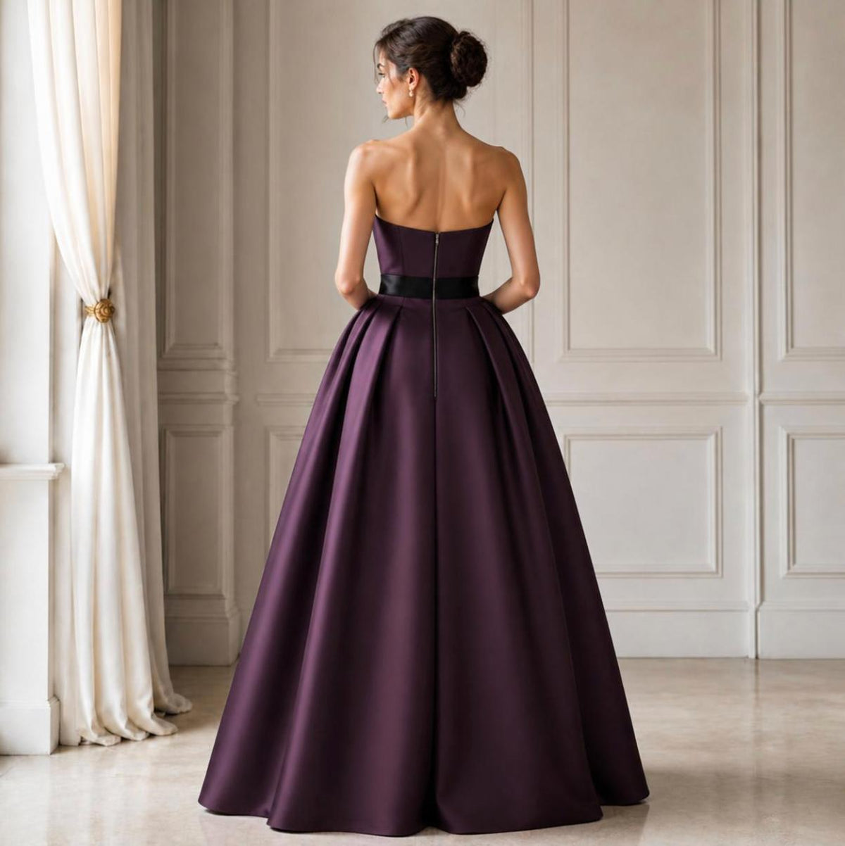 Strapless floor-length purple satin twill A-line gown with a black waist sash and back zipper closure.