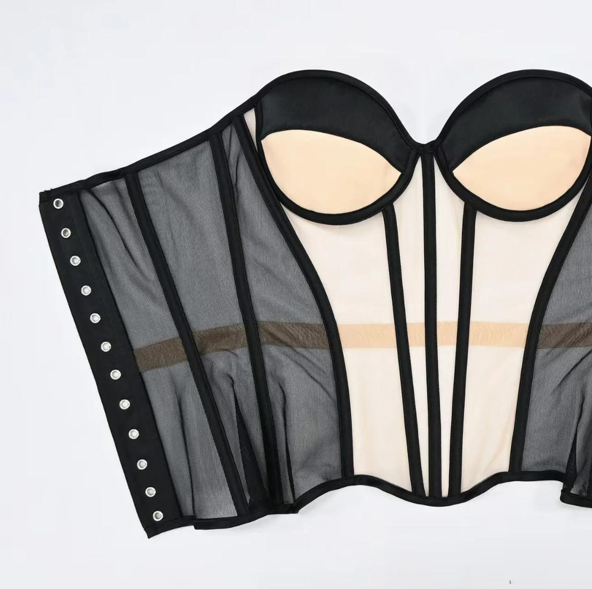 Dora handmade black mesh strapless corset with structured boning, padded cups, and silver grommet side closure.