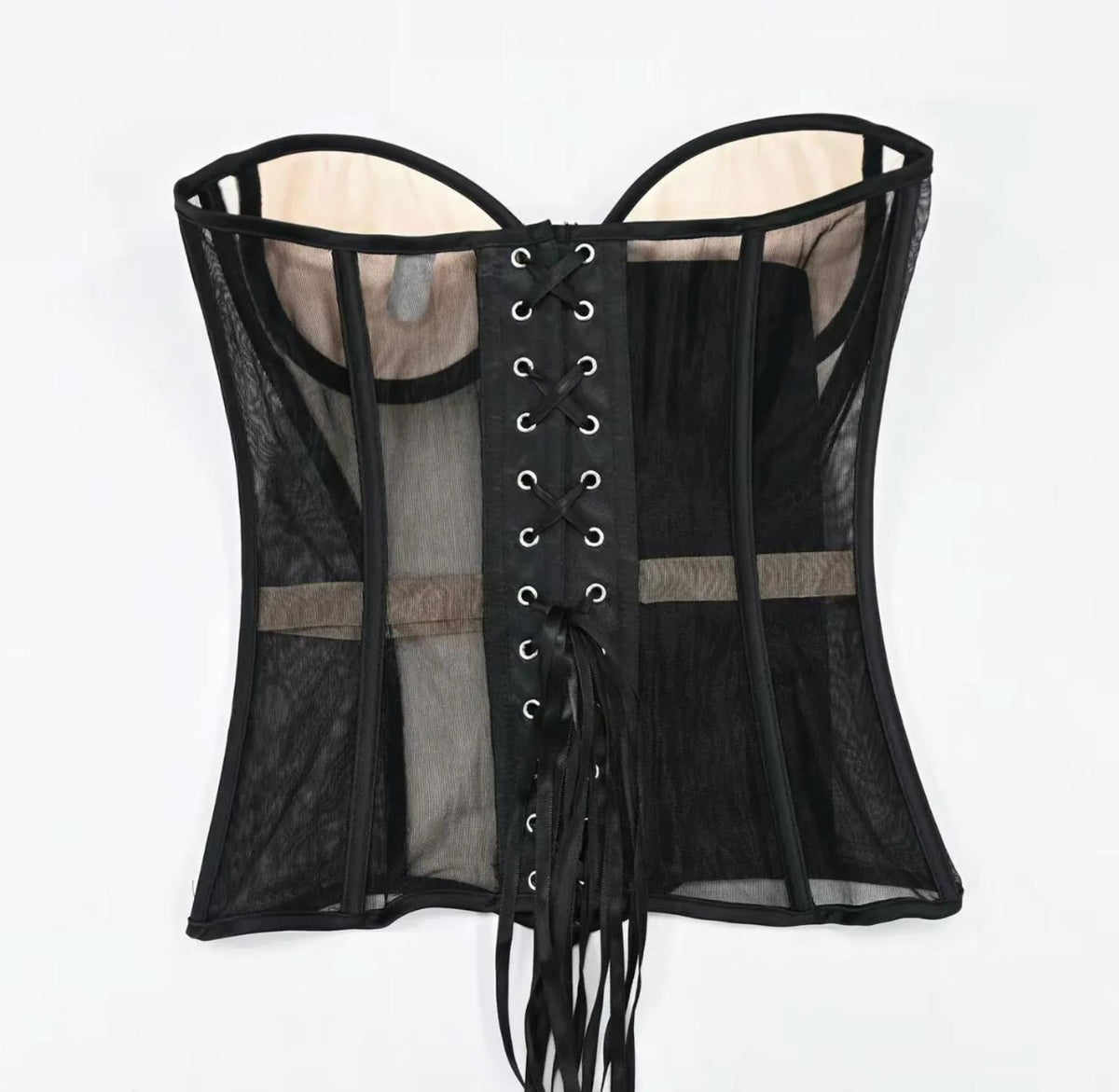 Black strapless mesh corset with structured boning, beige lining, and a front lace-up closure with ribbon ties.