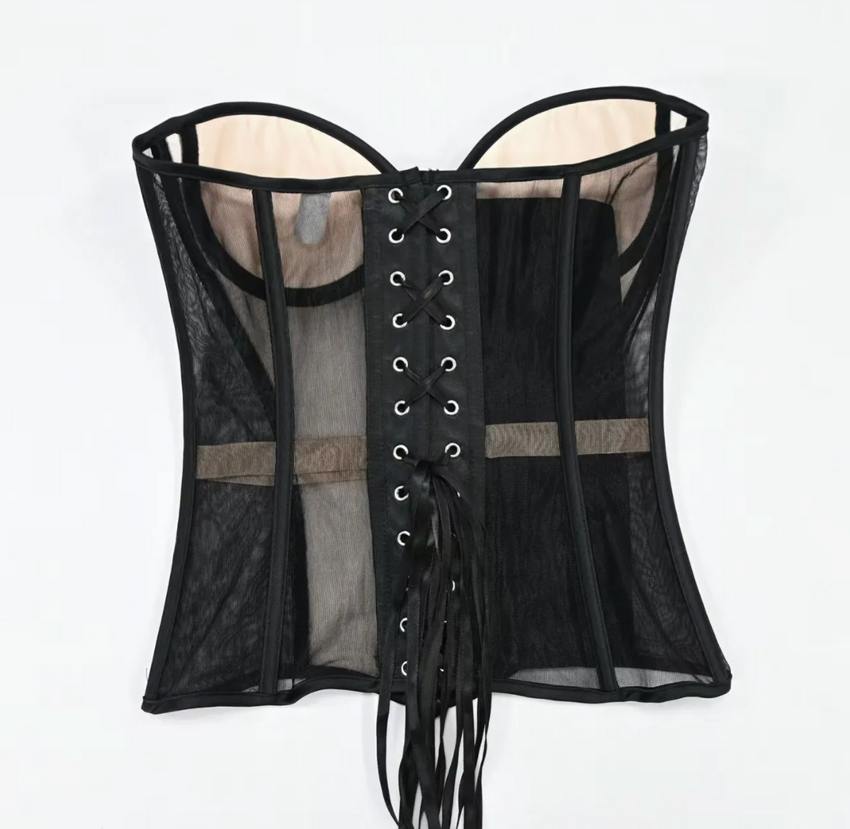 Black strapless mesh corset with structured boning, beige lining, and a front lace-up closure with ribbon ties.
