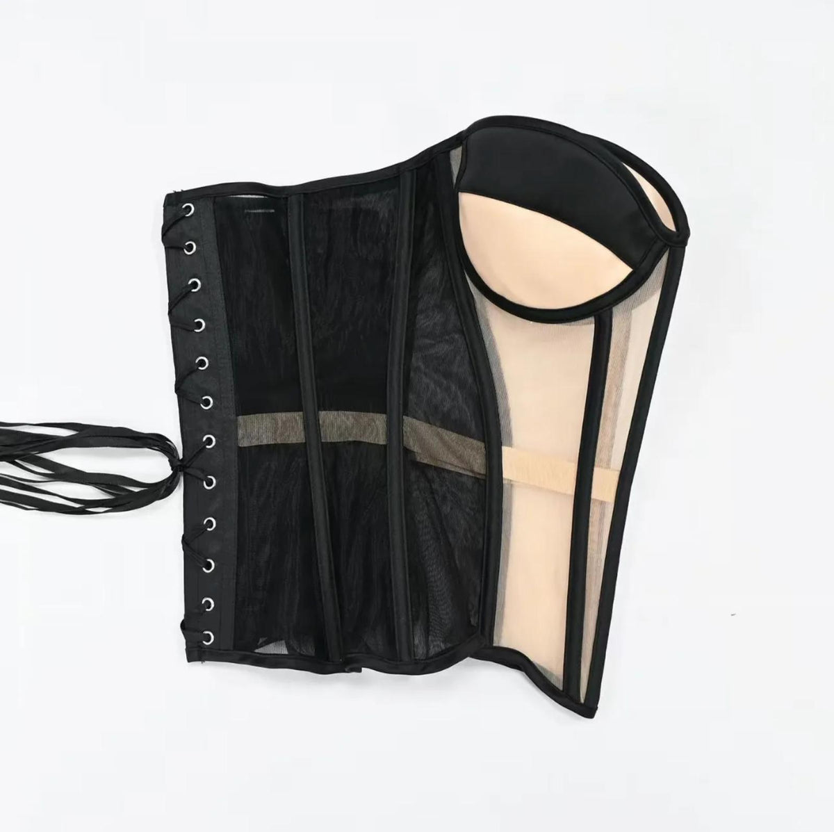 Black strapless mesh corset with structured boning, lace-up side closure, and beige molded bust cups.
