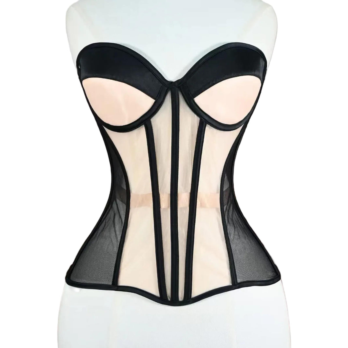 Black and nude mesh strapless corset with structured boning and architectural paneling on a mannequin.