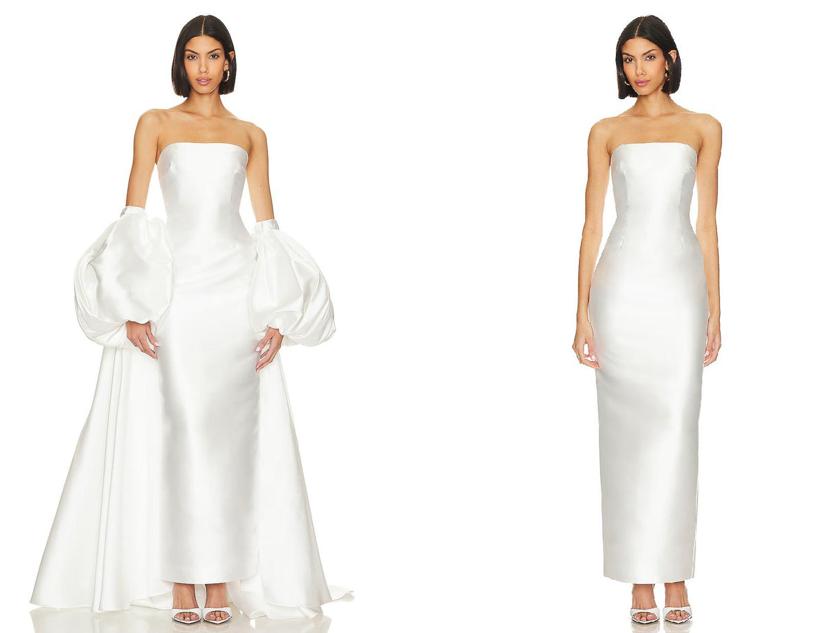 White strapless Mikado satin evening gown with a removable puff sleeve cape and full-length straight hem.