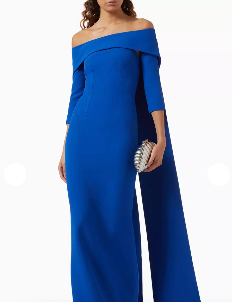 Royal blue off-the-shoulder floor-length gown with a train and three-quarter sleeves in smooth polyester.
