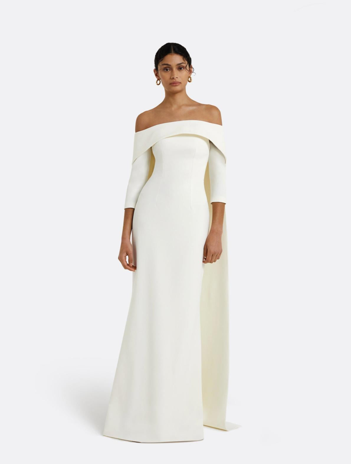 Elegant white off-the-shoulder floor-length gown with a train, crafted from smooth jersey fabric.