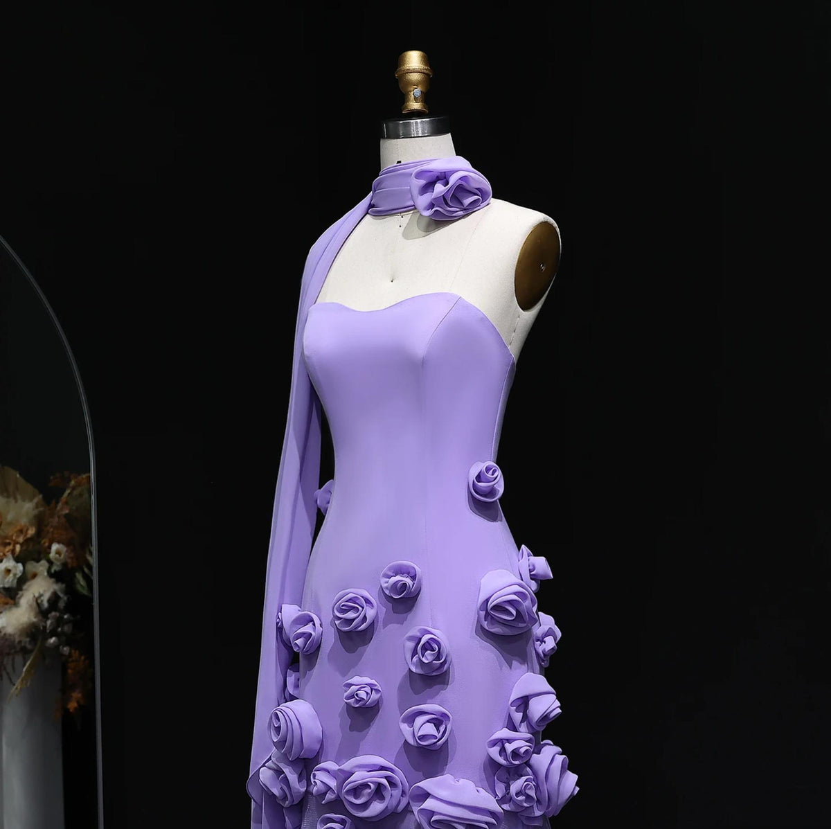 Lavender trumpet gown with sweetheart neckline, 3D floral appliqués, and matching scarf on a mannequin.