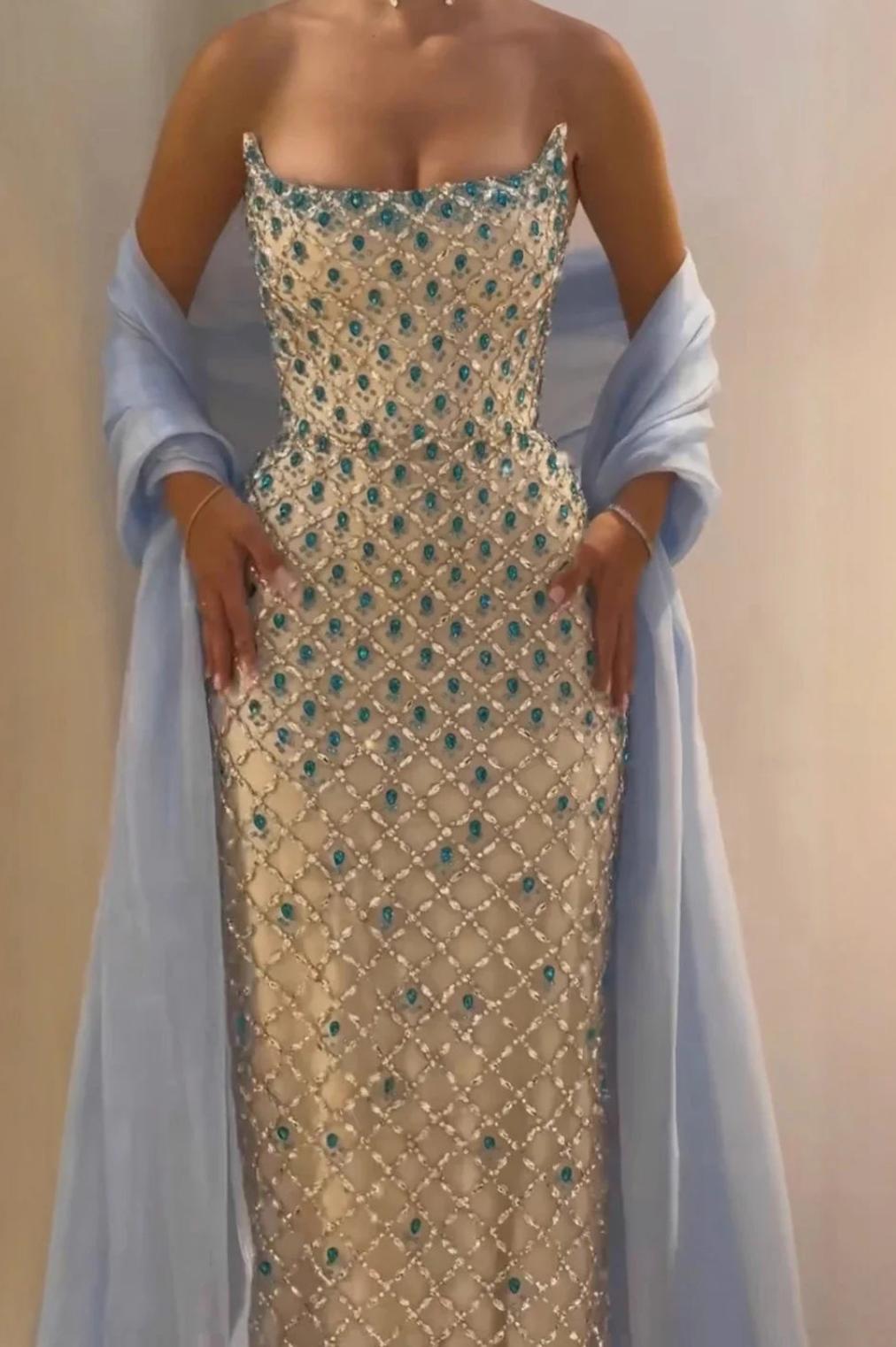Sleeveless satin evening gown with a crystal-beaded lattice bodice, blue stone accents, and a matching light blue shawl.