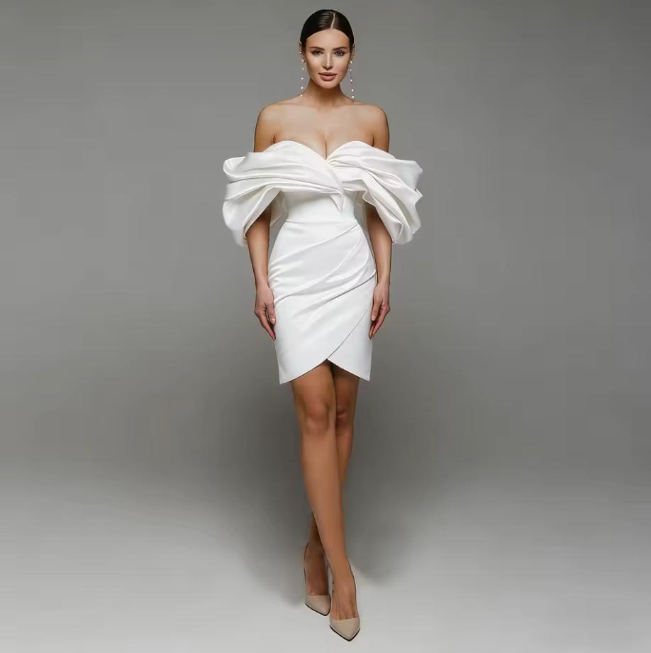 White satin mini gown with off-shoulder pleated sleeves, sweetheart neckline, and a fitted A-line silhouette.