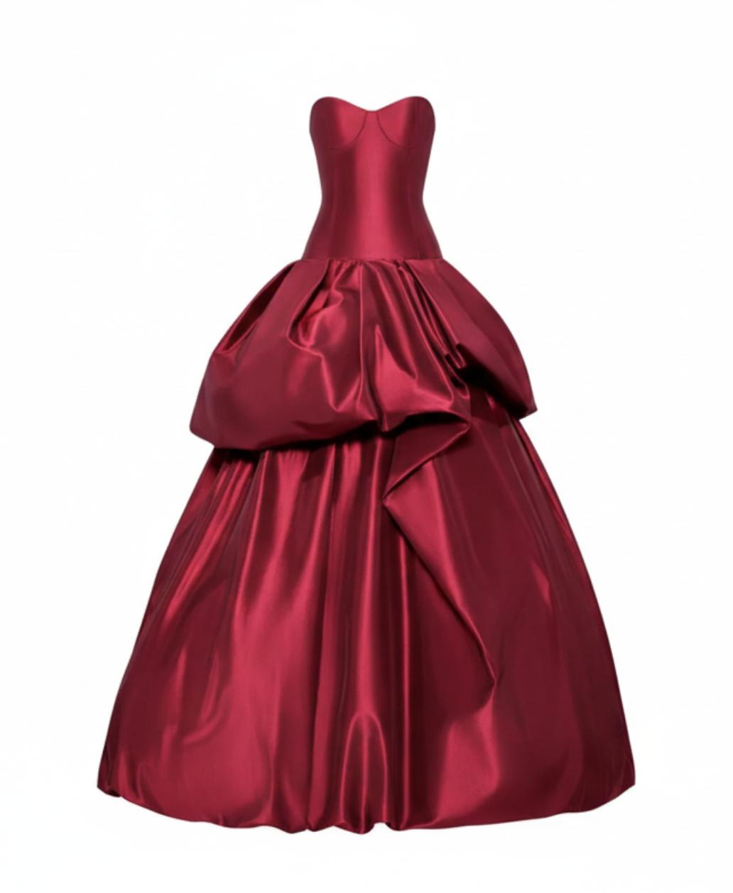 Strapless red silk taffeta ball gown with a structured corset bodice and dramatic tiered drop-waist skirt.