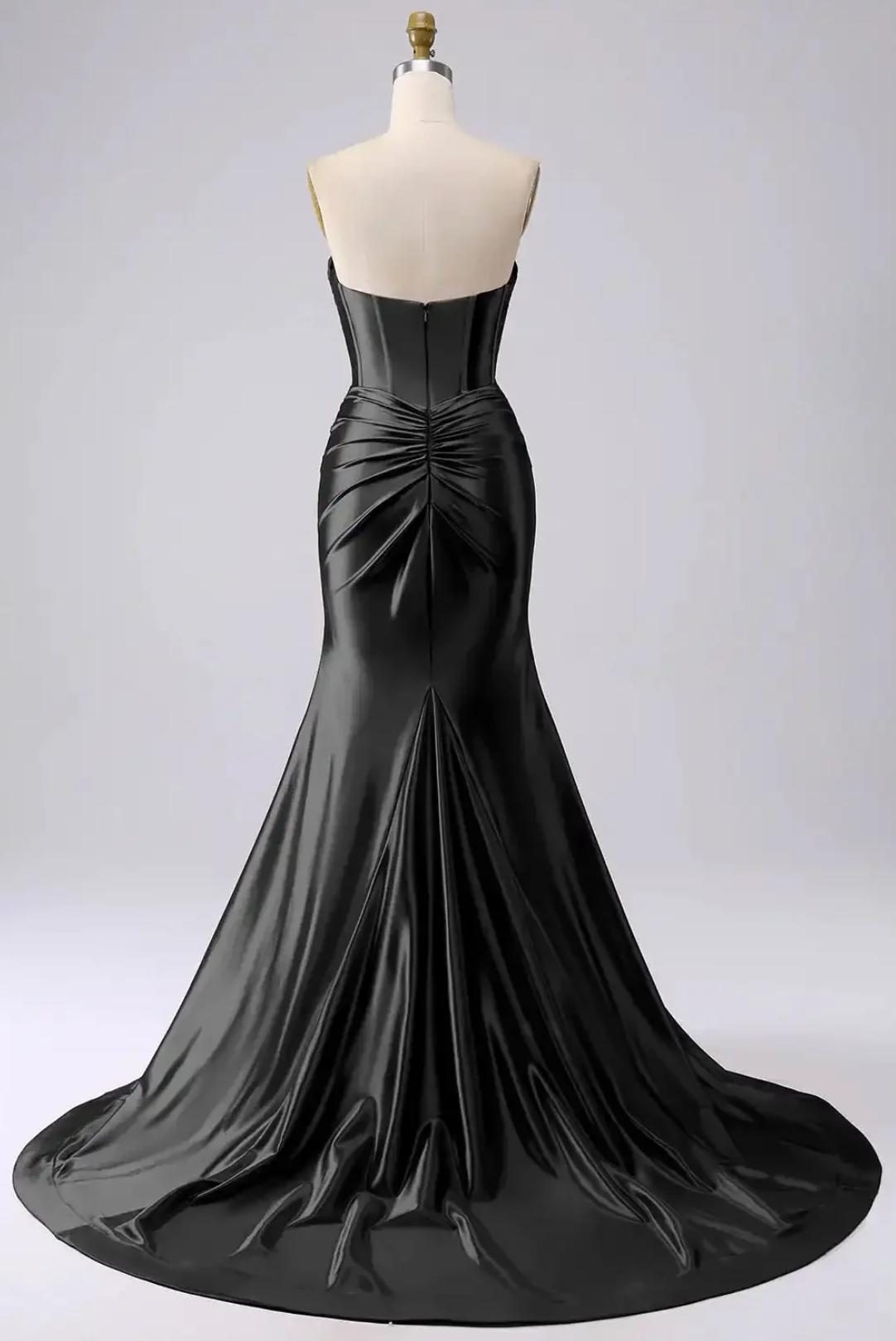 Back view of a black satin mermaid gown with a corset bodice, pleated detailing, and a floor-length trumpet skirt.