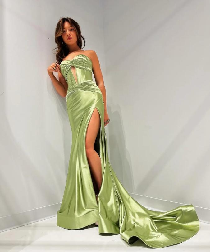 Lime green satin mermaid gown with a sweetheart neckline, corset bodice, and a dramatic high leg slit.