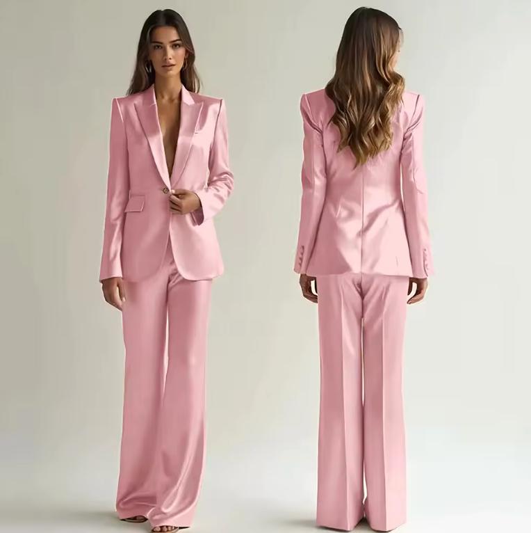 Woman wearing a pink satin two-piece suit with a single-button blazer and wide-leg trousers, shown from front and back.