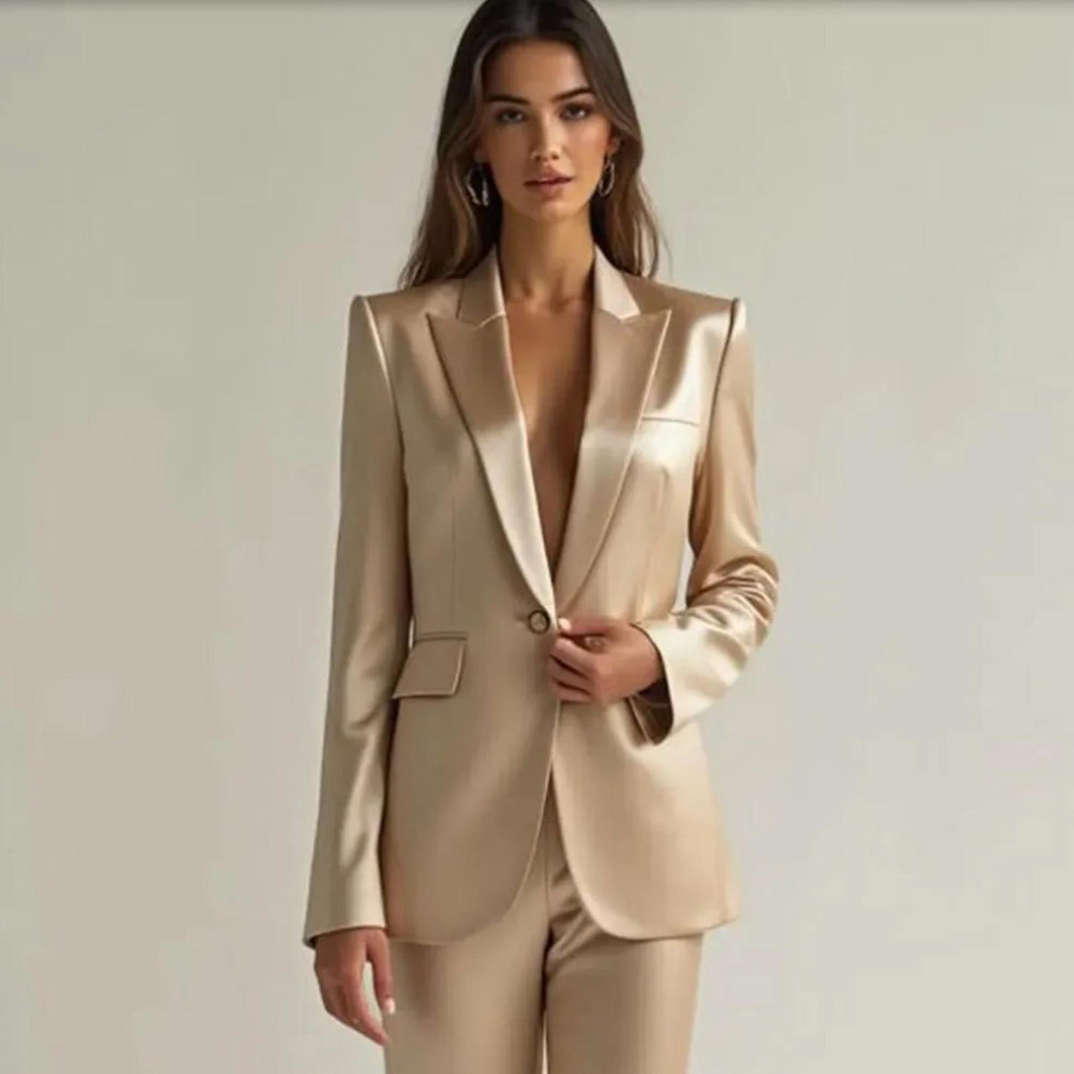 Champagne satin two-piece suit with a single-button blazer, notched collar, and tailored wide-leg trousers.
