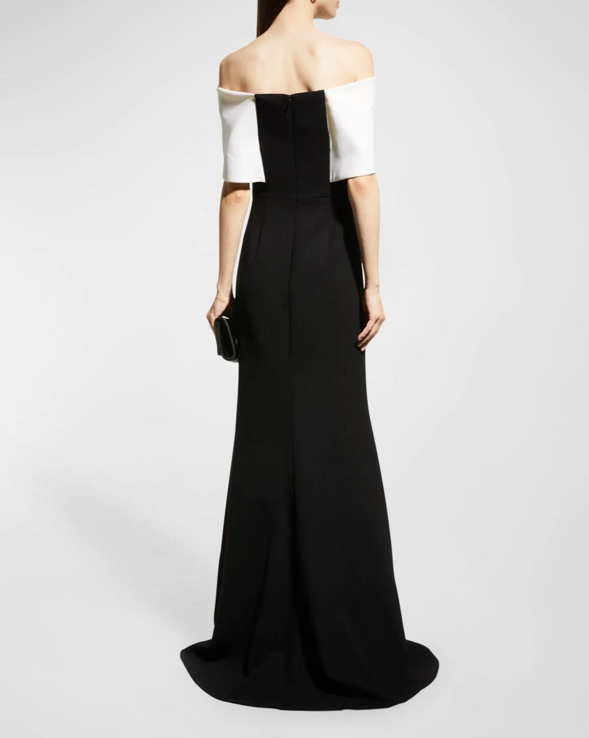 Two-tone off-the-shoulder black and white crepe mermaid gown with short sleeves and a back zipper closure.