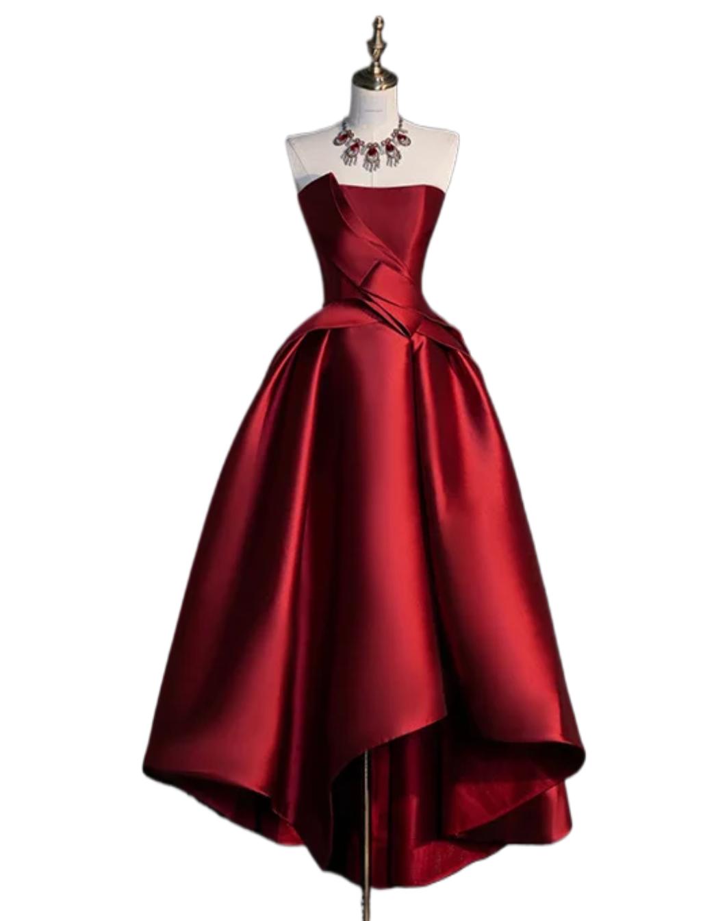 Red satin strapless midi dress with a structured corset bodice and elegant high-low A-line skirt on a mannequin.