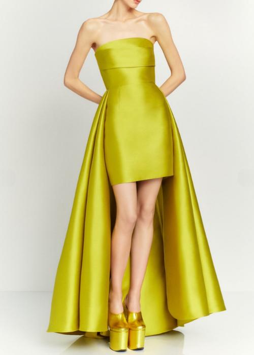 Strapless chartreuse mini dress with a dramatic detachable train and structured silhouette.