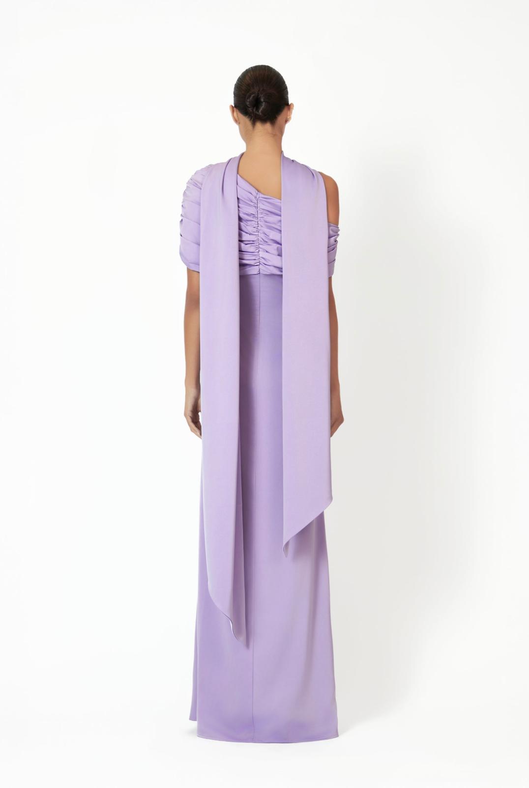 Back view of a lavender satin Kulture dress with a gathered Bardot neckline and flowing A-line silhouette.