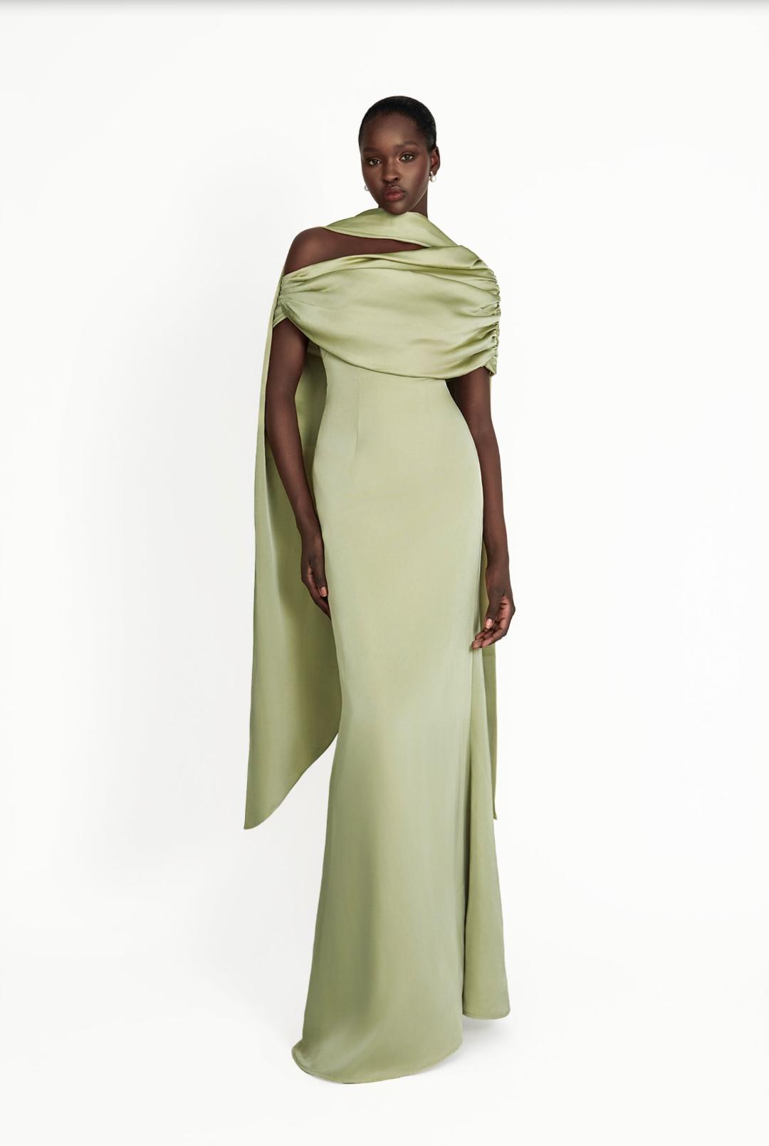 Sage green satin A-line gown with a gathered Bardot neckline and elegant draped shoulder detail.