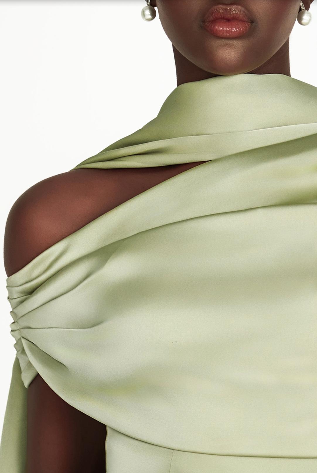 Sage green satin Kulture dress featuring a gathered Bardot neckline that elegantly highlights the shoulders.