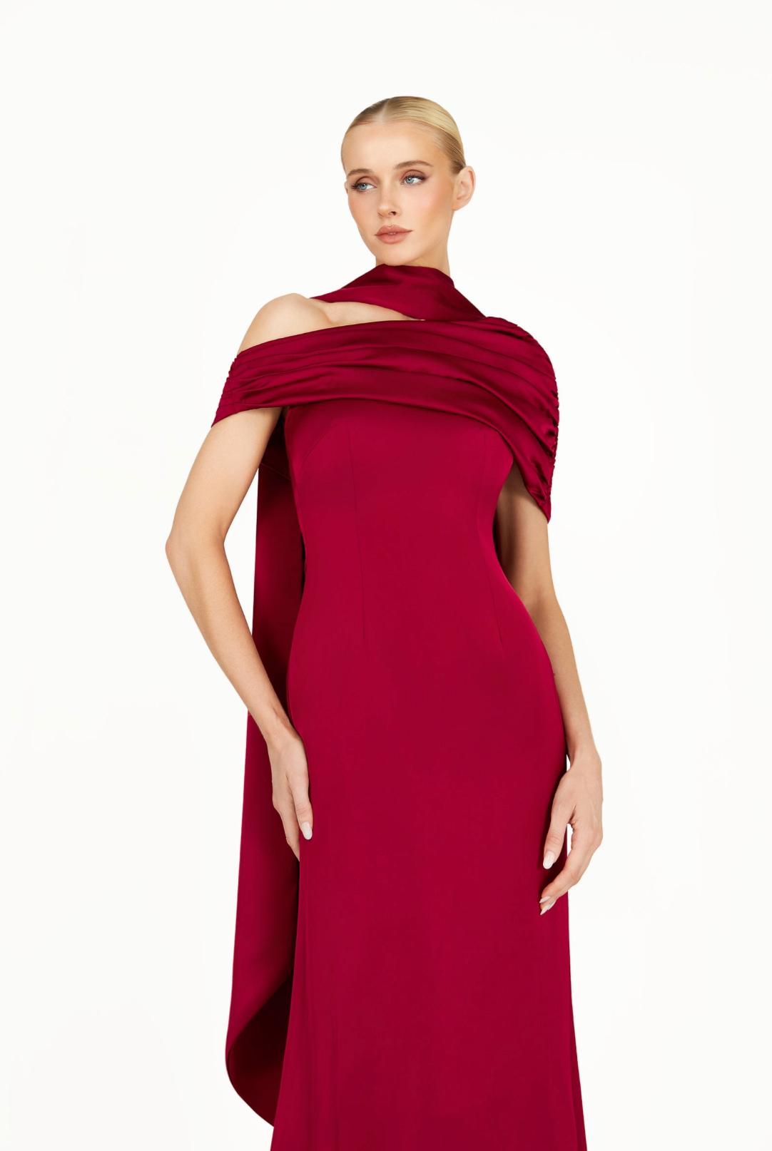Elegant deep red satin Kulture dress with a gathered Bardot neckline and flowing A-line silhouette.