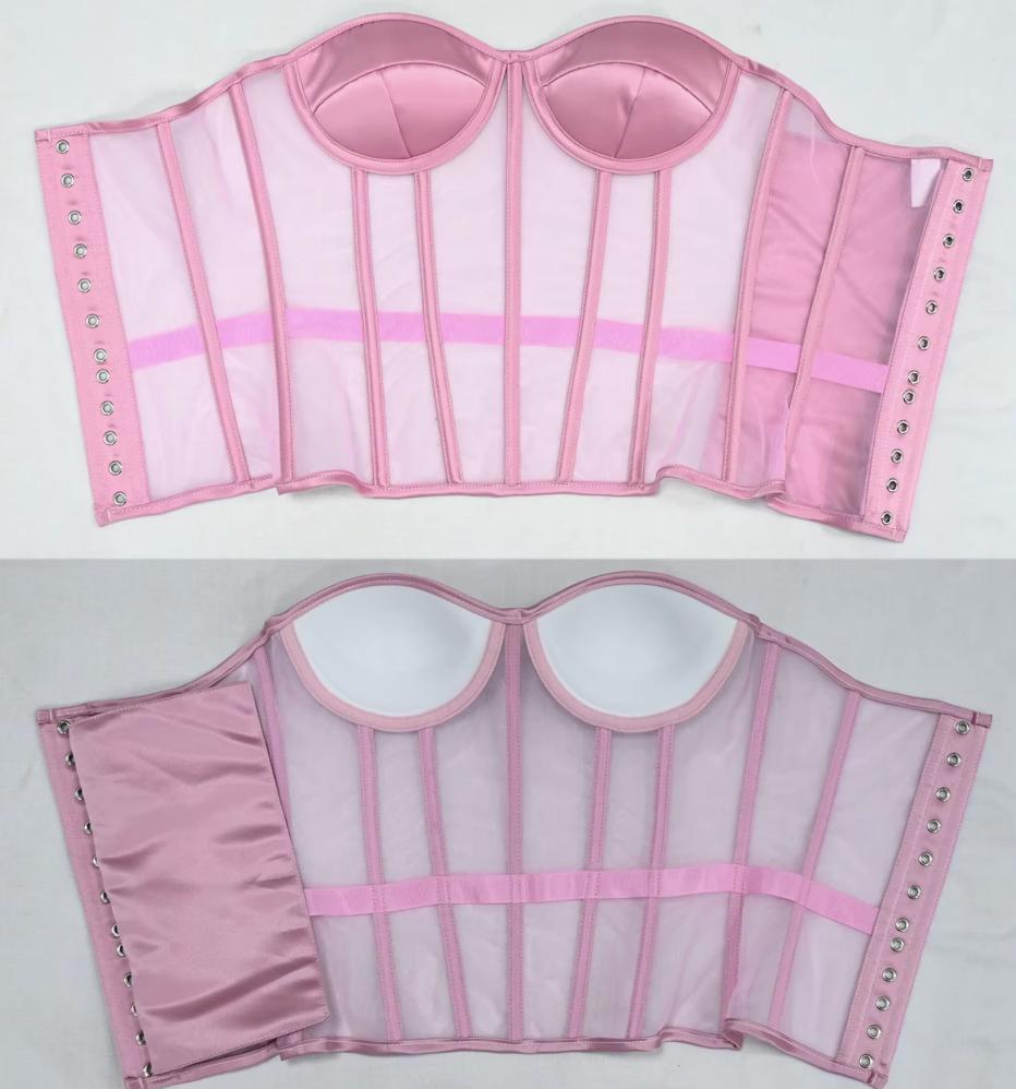 The Lilah pink structured bustier or corset top shown from both front and back on a light gray background. The garment has sheer mesh panels, satin-like fabric sections, vertical boning, adjustable side straps with metal eyelets, and molded cup shapes.