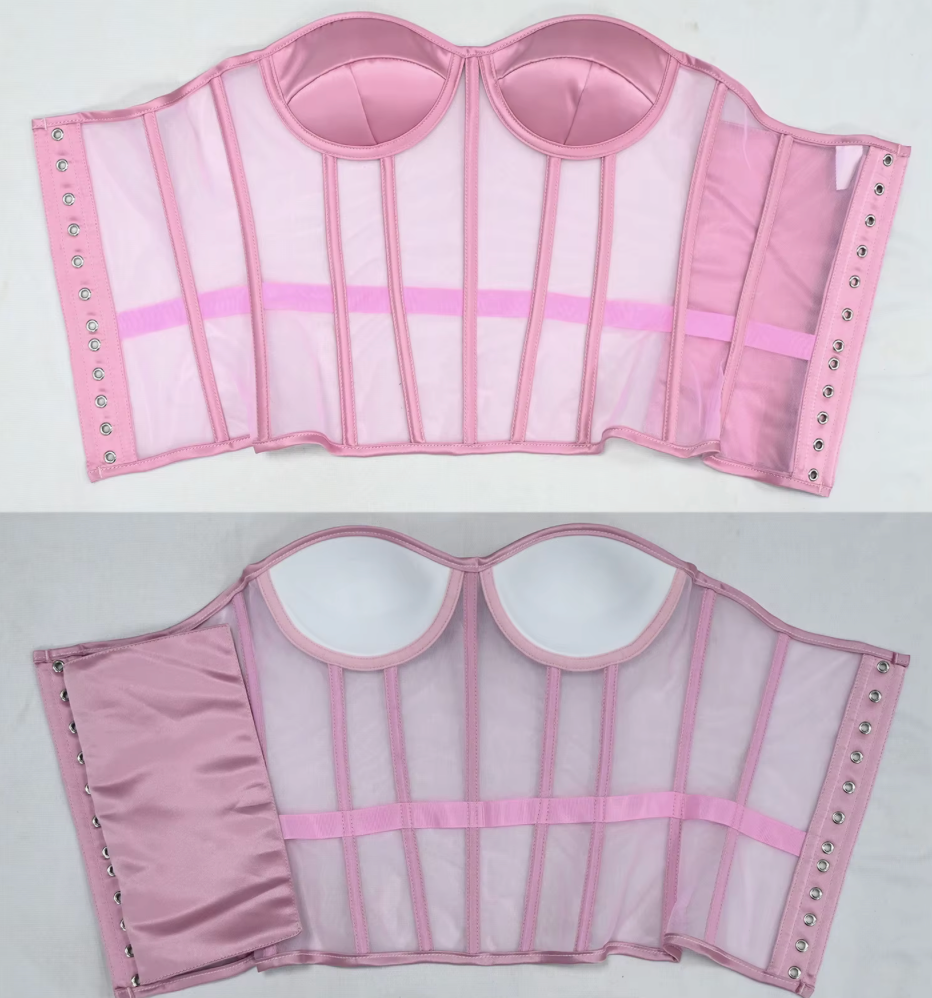 The Lilah pink structured bustier or corset top shown from both front and back on a light gray background. The garment has sheer mesh panels, satin-like fabric sections, vertical boning, adjustable side straps with metal eyelets, and molded cup shapes.