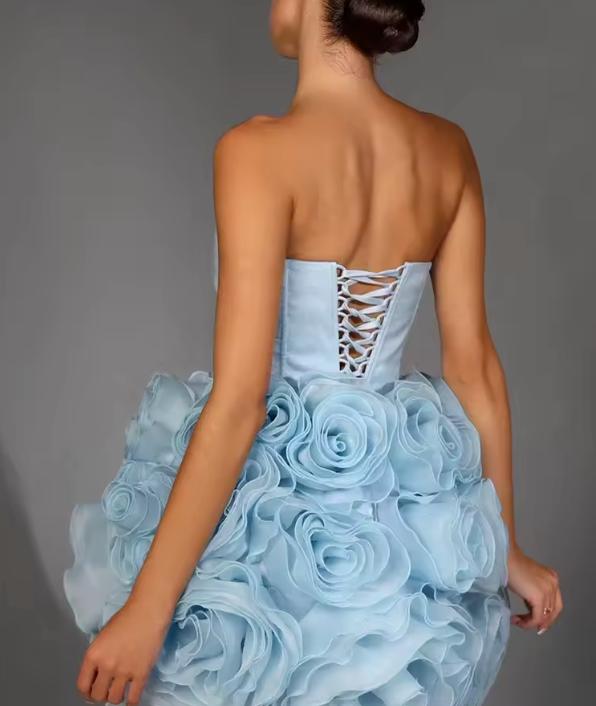 Light blue strapless corset mini dress with 3D organza flower details and a lace-up back closure.