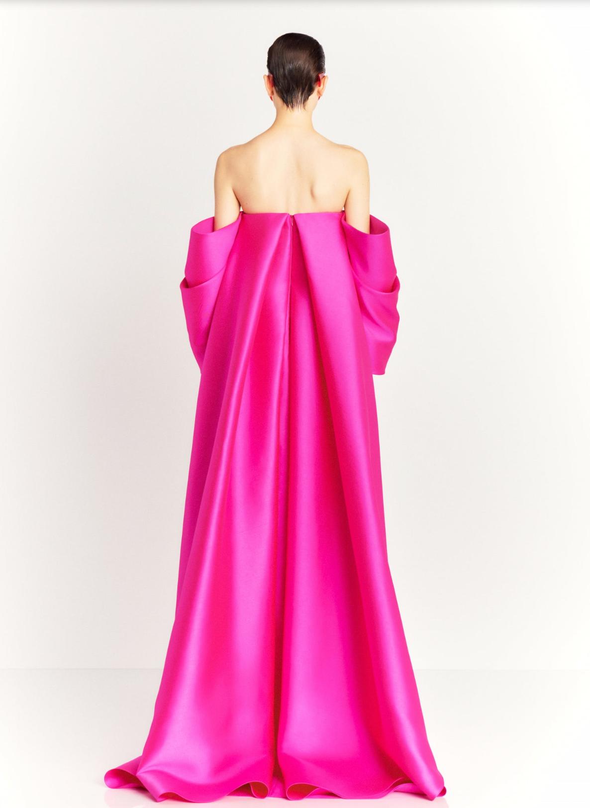 Hot pink strapless satin evening gown with a dramatic court train and off-the-shoulder sleeves.