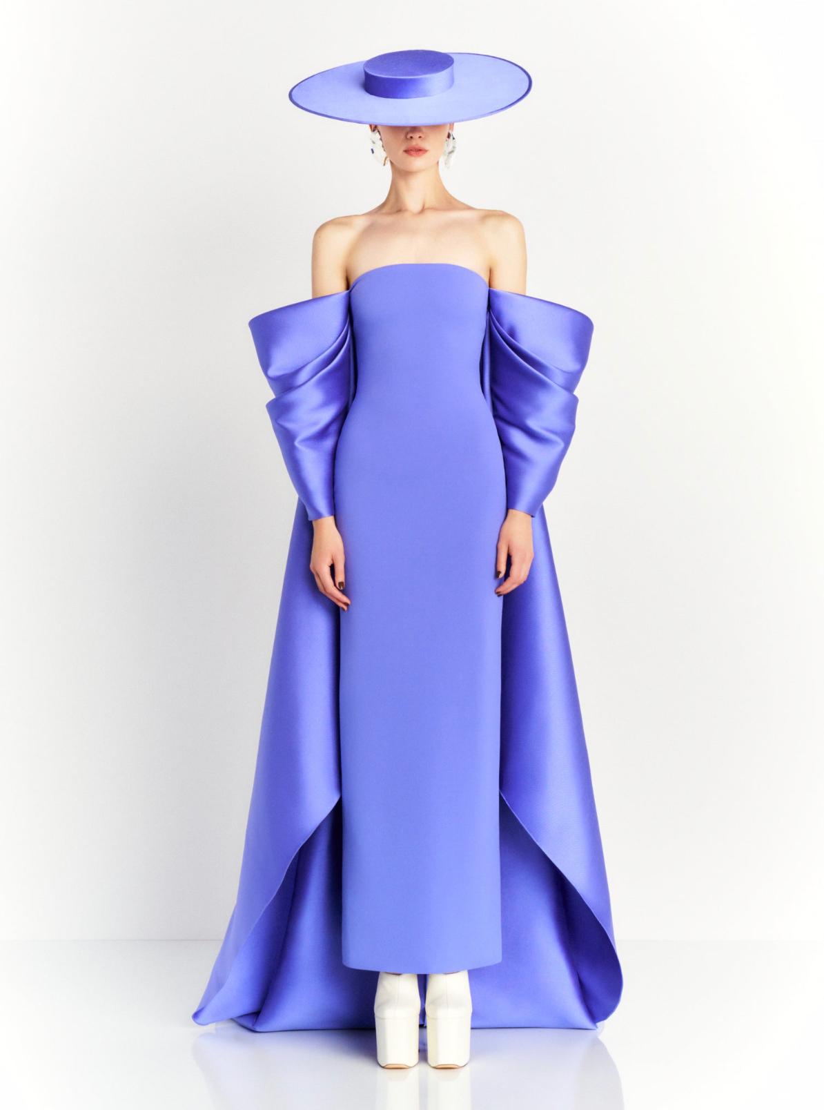 Strapless purple satin evening gown with dramatic puffed sleeves, a court train, and a matching wide-brimmed hat.