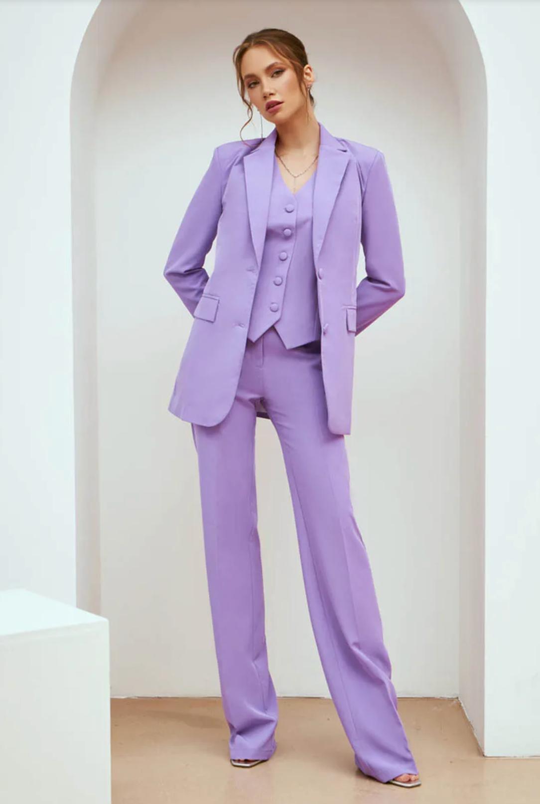 Lavender three-piece suit featuring a single-breasted blazer, button-up vest, and tailored trousers in sleek serge fabric.