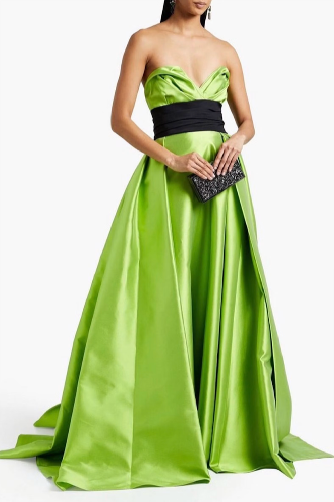 Sleeveless lime green Mikado satin gown with a sculpted sweetheart neckline and a contrasting black waist sash.
