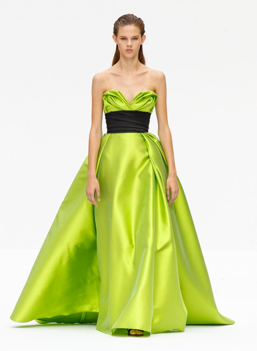 Lime green sleeveless Mikado satin gown with a sculpted sweetheart neckline and a contrasting black waist sash.