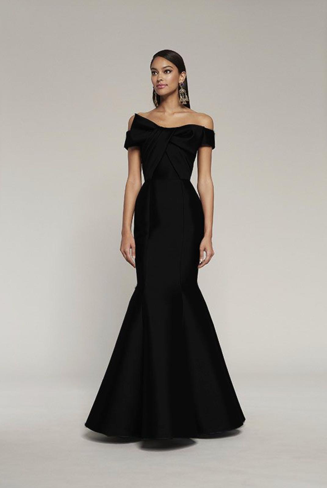 Black off-the-shoulder satin mermaid gown featuring a draped bodice and elegant bow detail.