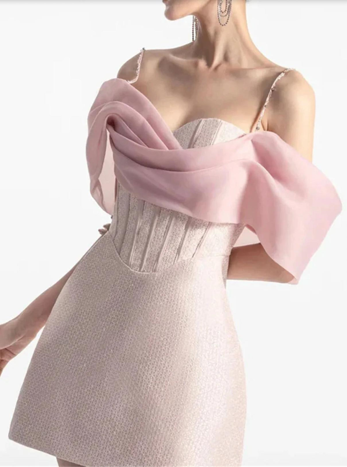 Pink satin mini dress with a sweetheart neckline, corset-style bodice, and elegant draped off-shoulder sleeves.