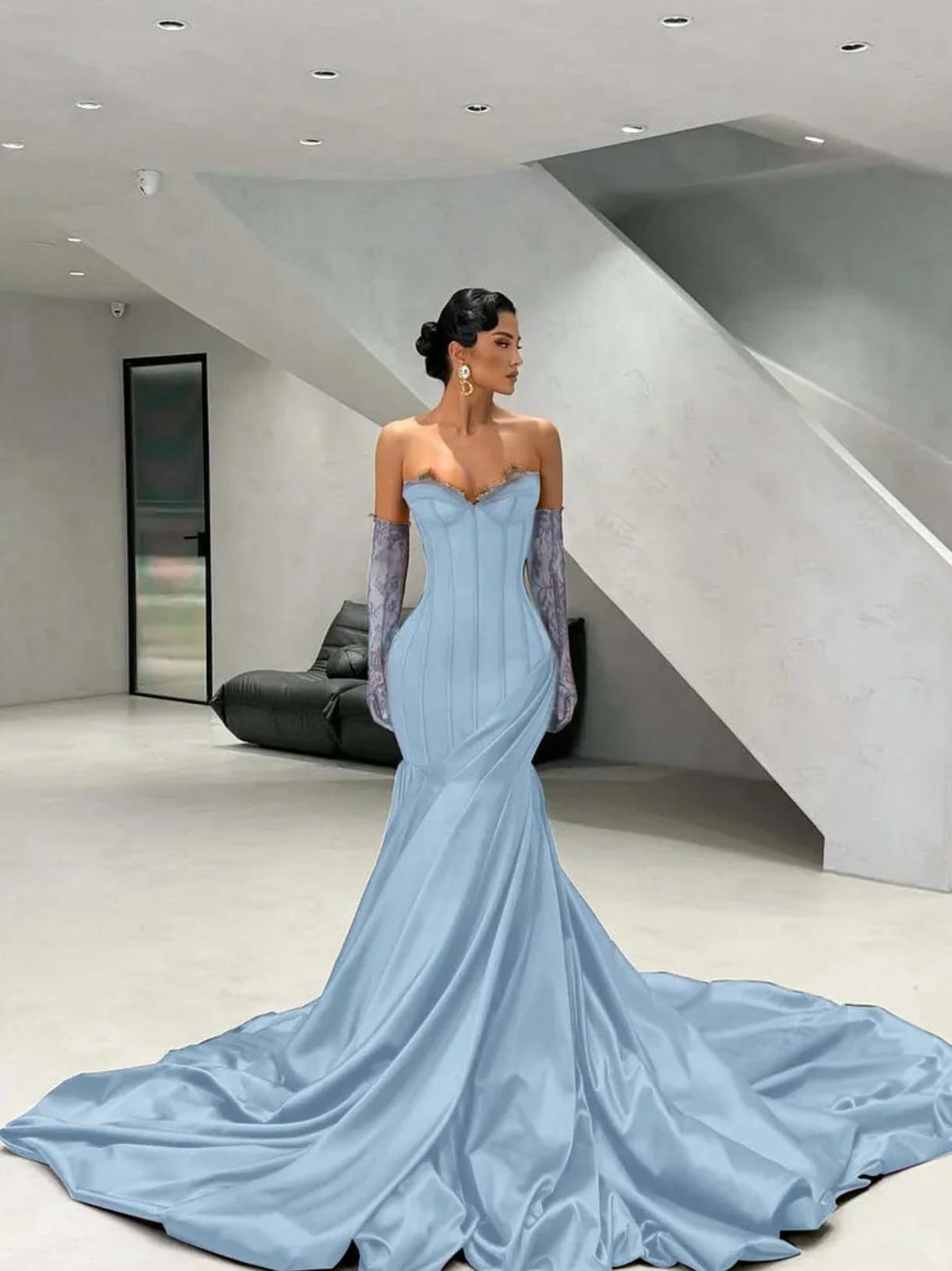 Light blue satin corset gown with a sweetheart neckline, lace detailing, and matching opera gloves with a floor-length train.