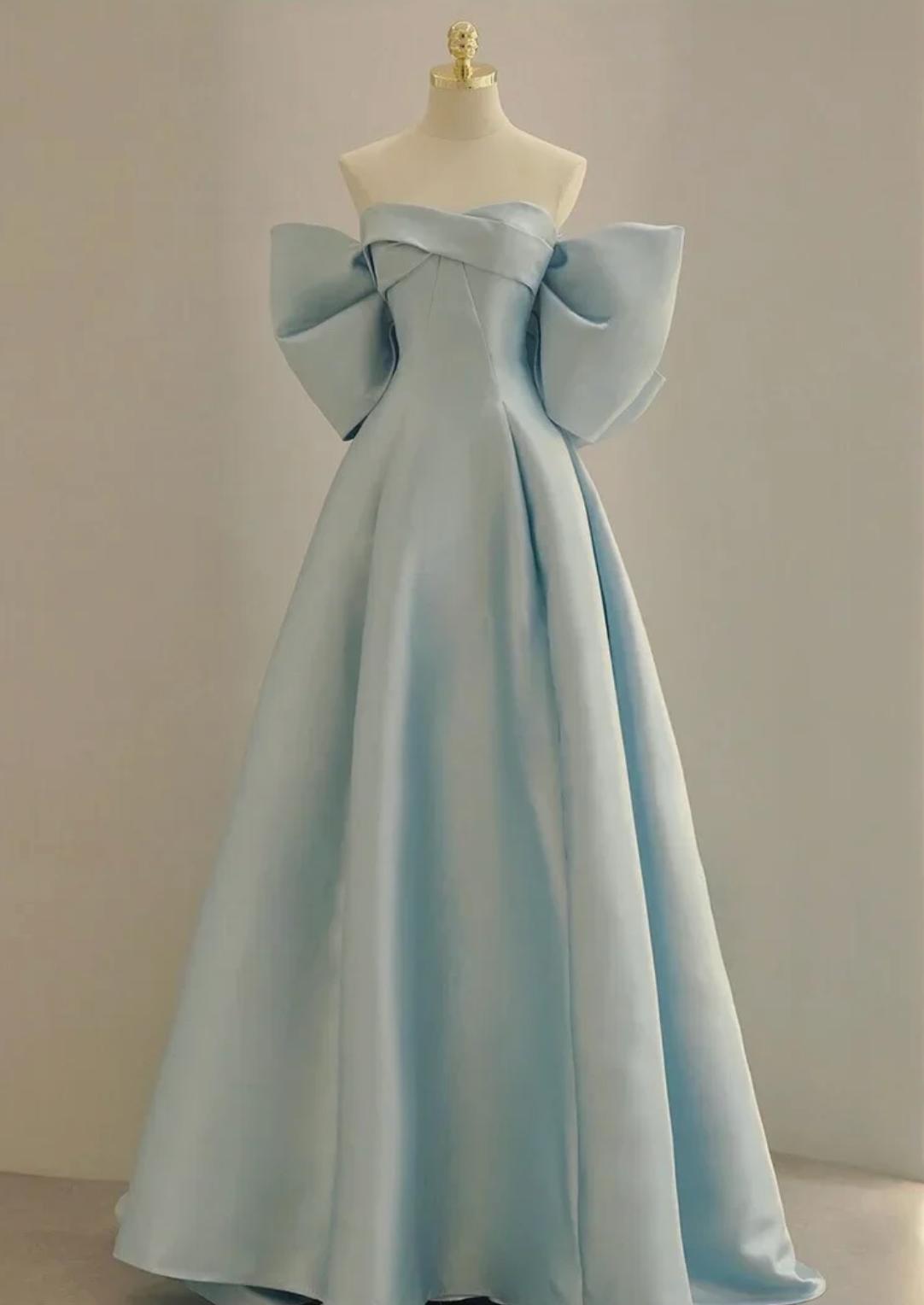 Light blue satin A-line evening gown with an off-the-shoulder neckline and dramatic bow sleeve details.