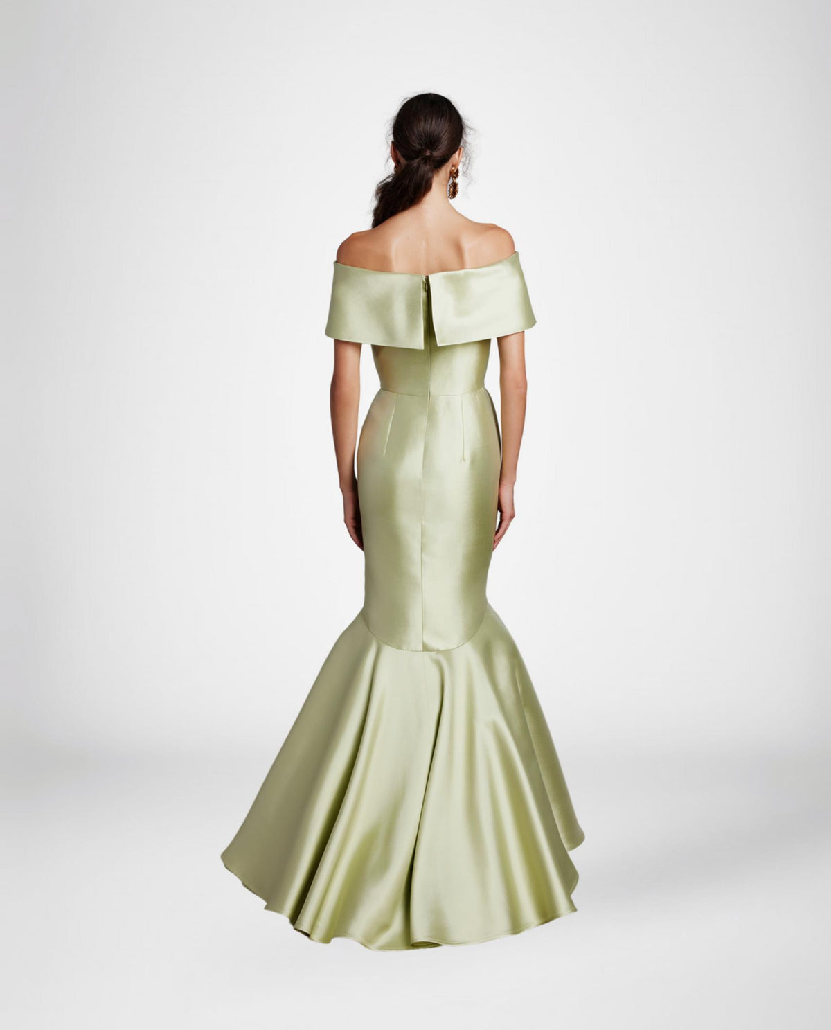 Back view of a sage green satin off-the-shoulder mermaid gown with a wide collar and floor-length flared skirt.