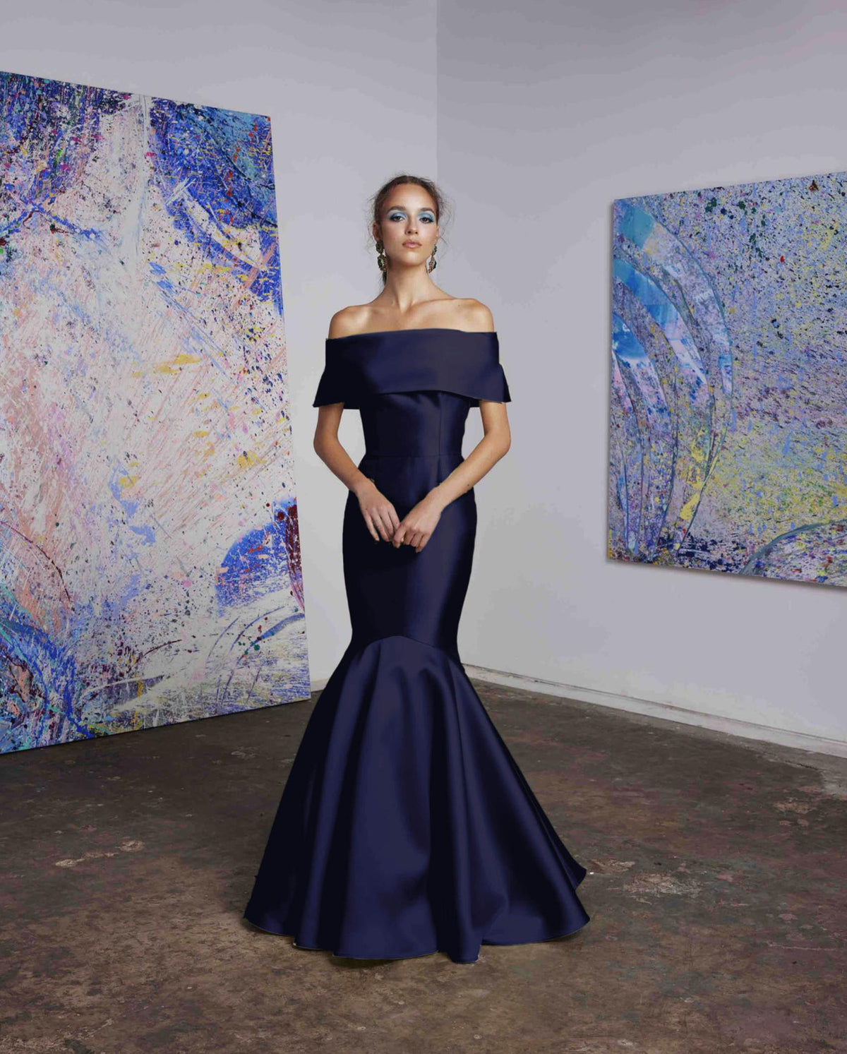 Navy blue satin off-the-shoulder mermaid gown with a wide collar band and floor-length skirt for formal events.